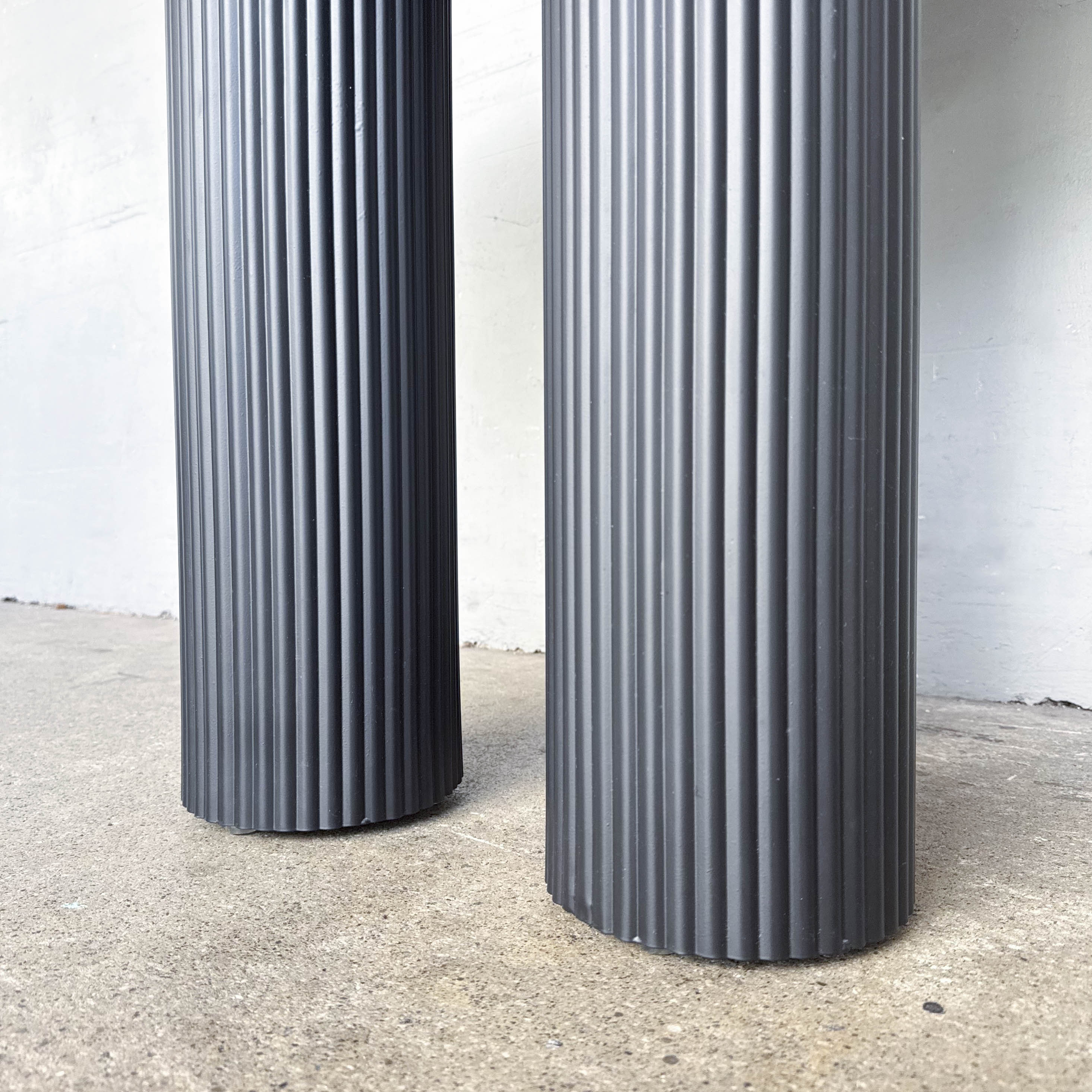 Ribbed Black Pedestal Round Table