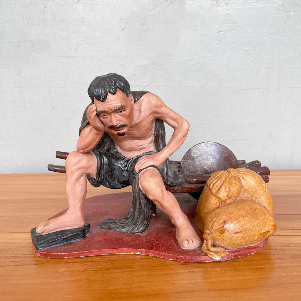 Resting Labourer with Wheelbarrow Ceramic Figurine
