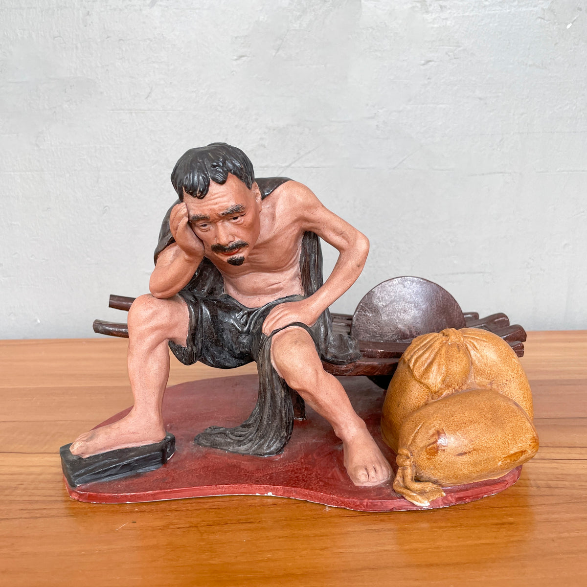 Resting Labourer with Wheelbarrow Ceramic Figurine