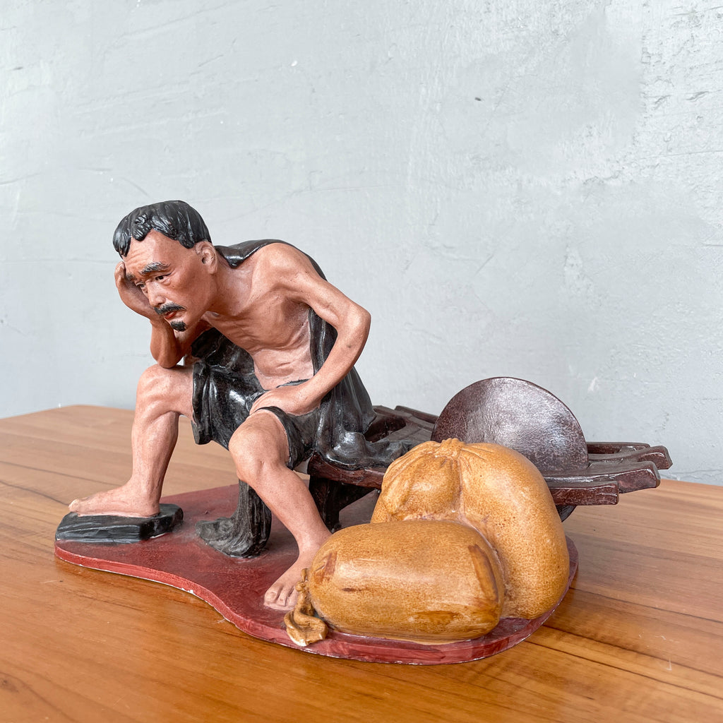 Resting Labourer with Wheelbarrow Ceramic Figurine