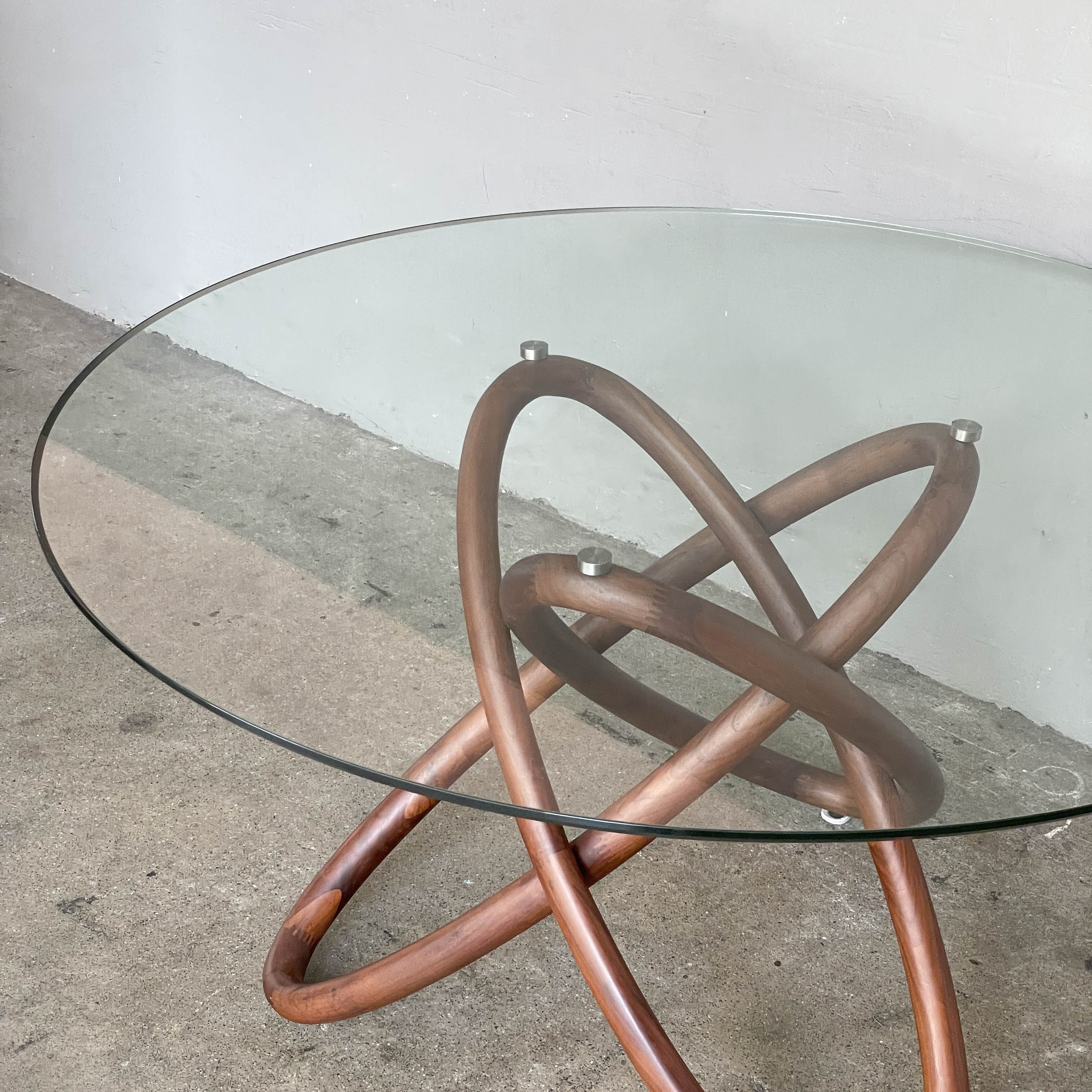 Glass Top Dining Table with Interlocking Ring Base